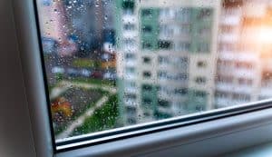 natural water drop on glass in calagary home in alberta. selective focus.