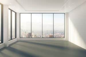 Modern empty room with windows in floor and city view