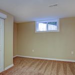 empty room, sand beige walls, carpet floor in a luxury home.