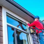 a window specialist seal gaps in windows to prevent drafts on a modern home in calgary