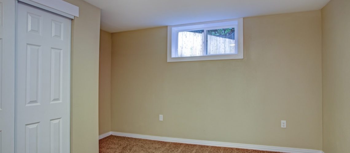Empty room, sand beige walls, carpet floor in a luxury home.
